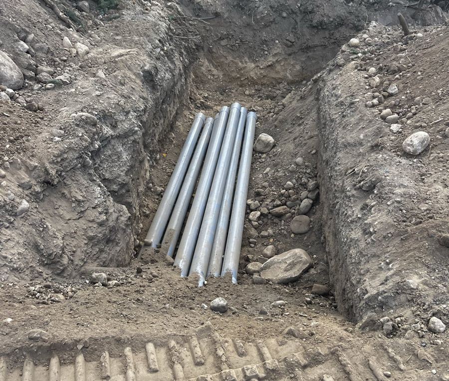 Trenched conduit runs in an open excavation